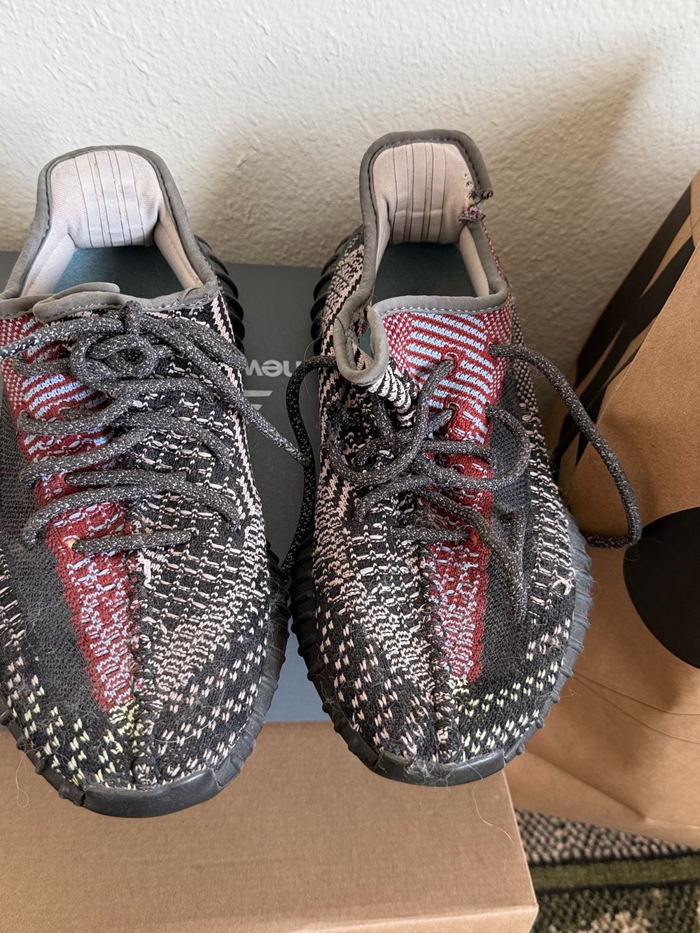 Woman Yeezy Knit Athletic Sneakers in Black and Red